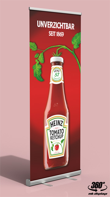 Werbeplakat mit Tomatenketchup-Flasche und Tomatenranken.